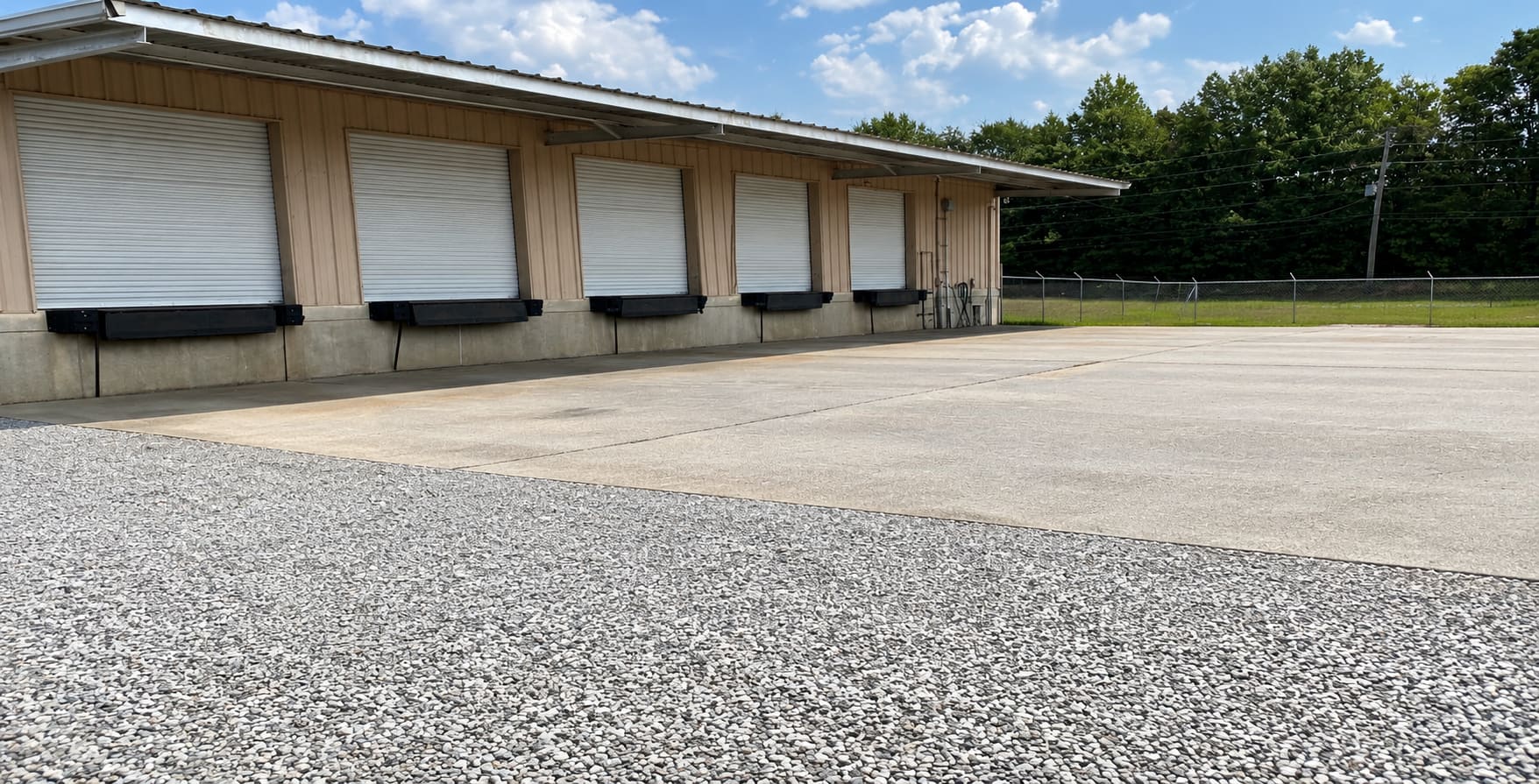 MEI Logistics loading dock and fenced storage yard in Meridian, Mississippi